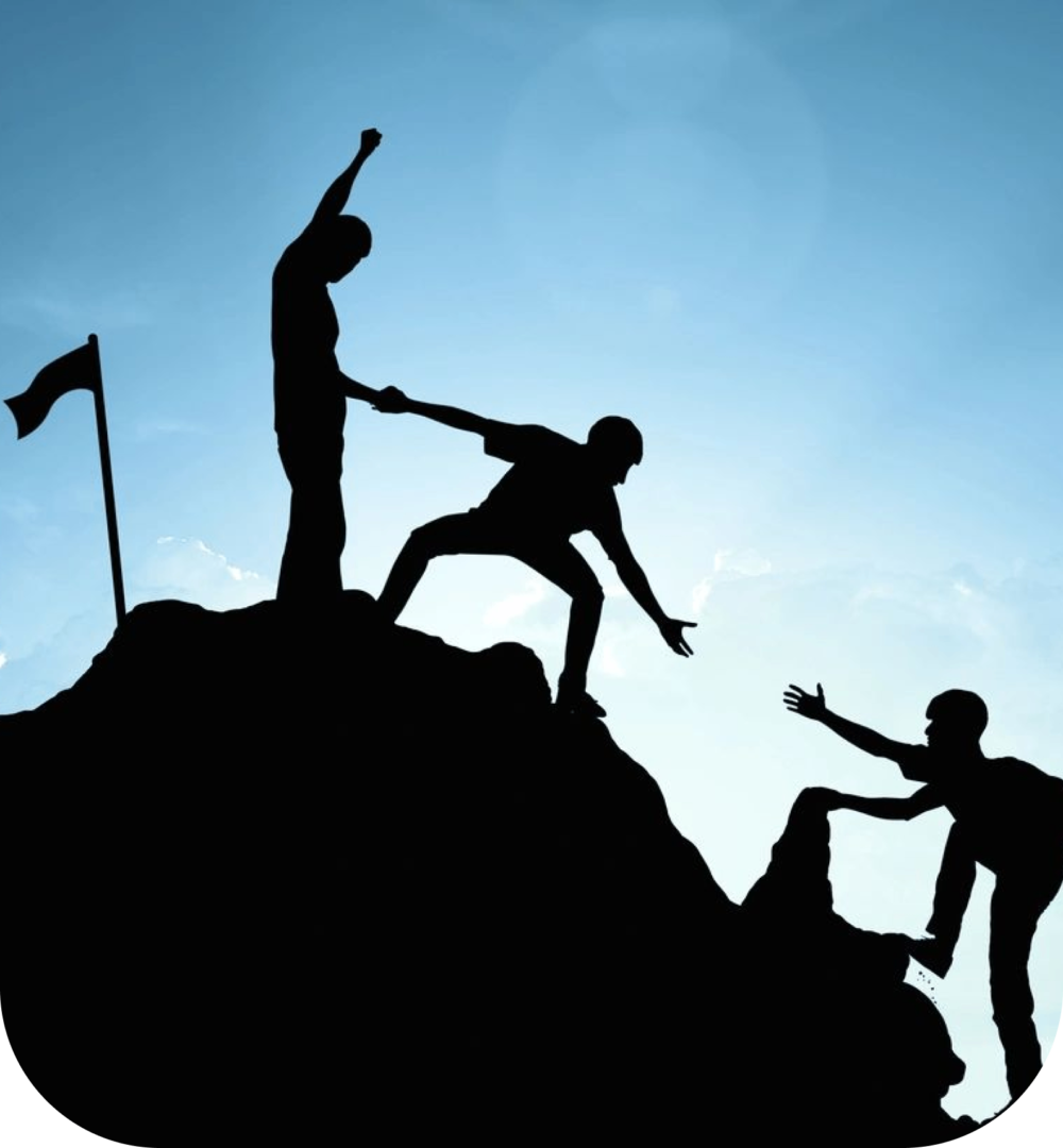 A group of people climbing up the side of a hill.